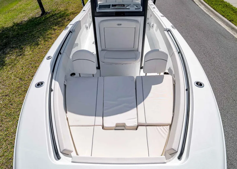 Slide: The Image of 2025 Sea Hunt Gamefish 25 boat interior with cushioned seating and storage compartments. - 28