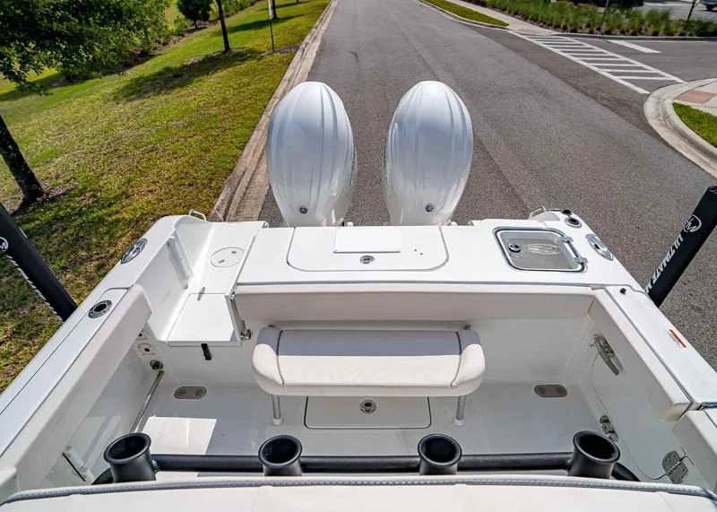 Slide: The Image of 2025 Sea Hunt Gamefish 25 boat interior with dual engines and seating area. - 8