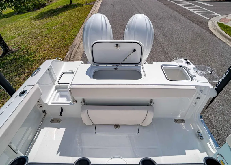 Slide: The Image of 2025 Sea Hunt Gamefish 25 boat deck with storage compartments and seating. - 9