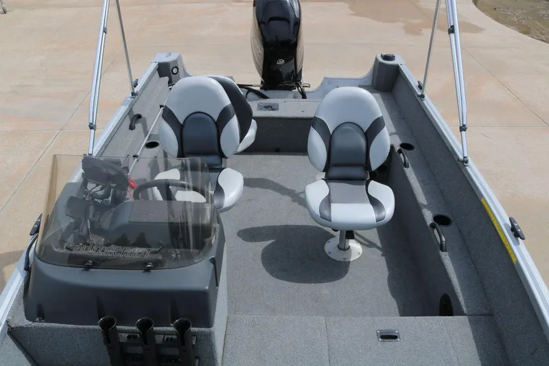 Slide: The Image of 2014 Alumacraft Competitor 165 CS boat interior with two seats and steering console. - 10