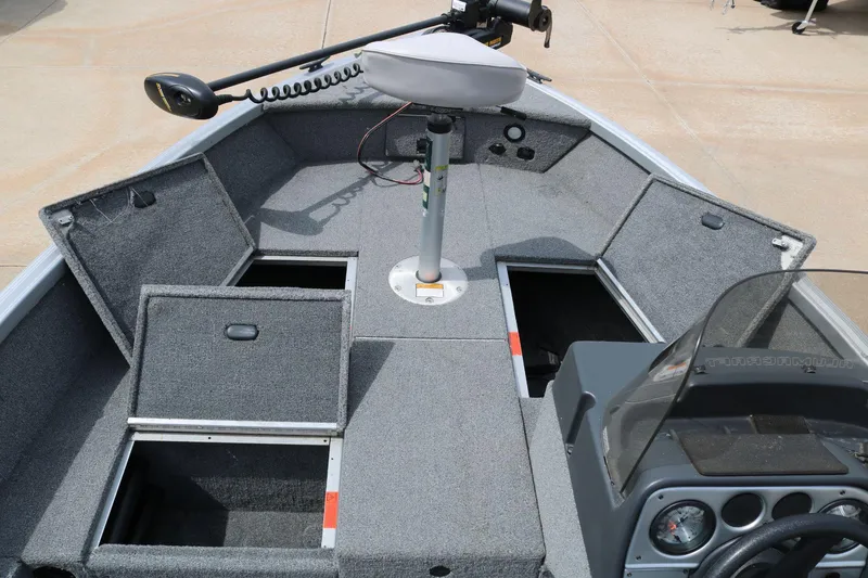 Slide: The Image of 2014 Alumacraft Competitor 165 CS boat interior with storage compartments open. - 12