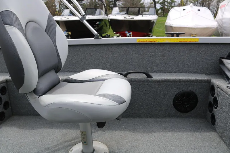 Slide: The Image of 2014 Alumacraft Competitor 165 CS boat interior with gray seating and measurement ruler. - 14