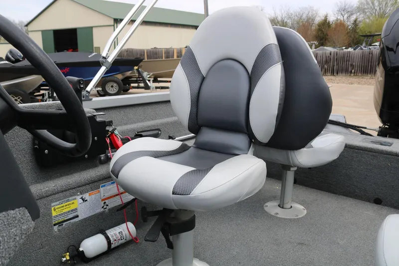 Slide: The Image of 2014 Alumacraft Competitor 165 CS boat interior with gray and white seating. - 19