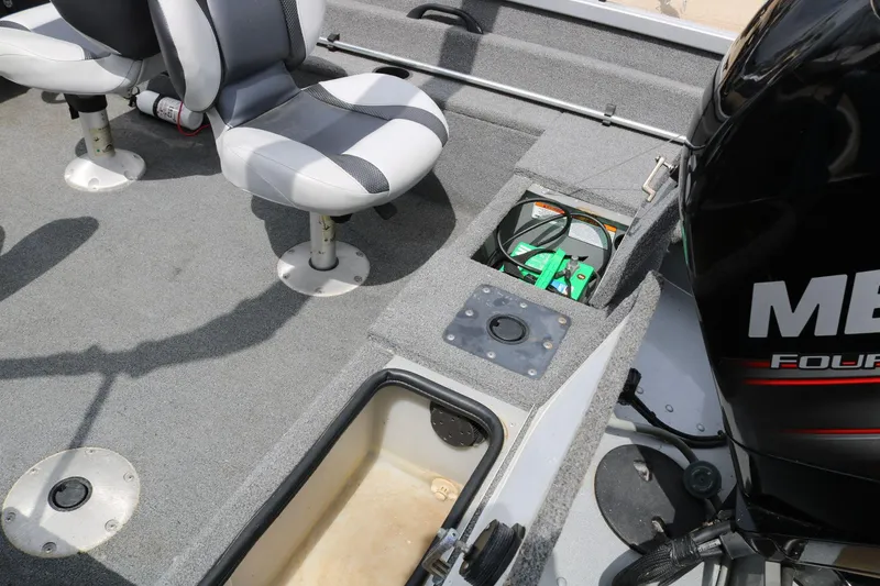 Slide: The Image of 2014 Alumacraft Competitor 165 CS boat interior with seating and engine view. - 22