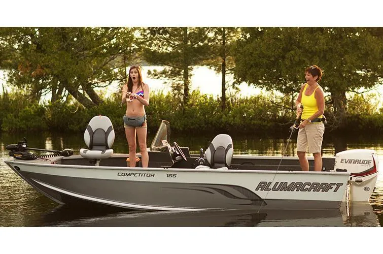 Slide: The Image of 2014 Alumacraft Competitor 165 CS boat with two people fishing on a calm lake. - 30