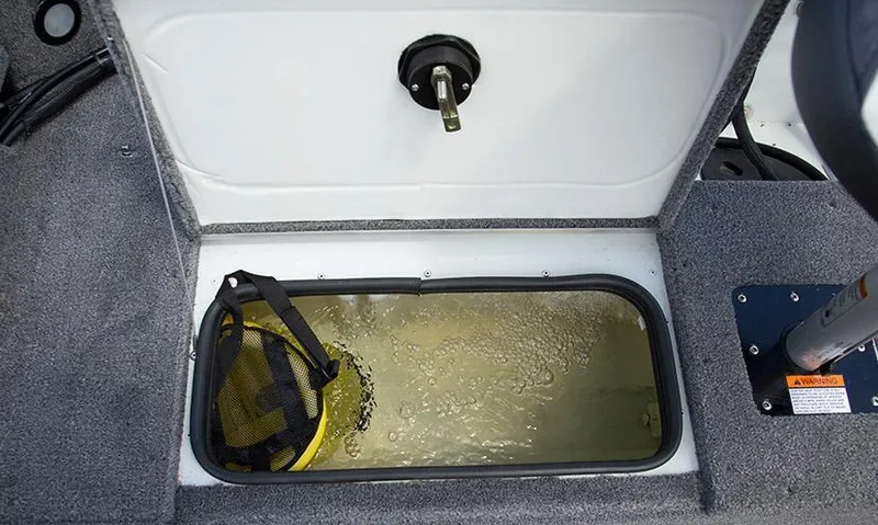 Slide: The Image of Livewell compartment in 2014 Alumacraft Competitor 165 CS boat, featuring aerated water and storage. - 34