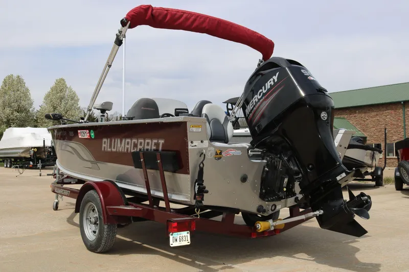 Slide: The Image of 2014 Alumacraft Competitor 165 CS boat with Mercury engine on trailer. - 6