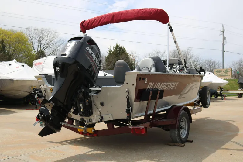Slide: The Image of 2014 Alumacraft Competitor 165 CS boat with Mercury outboard motor on trailer. - 8