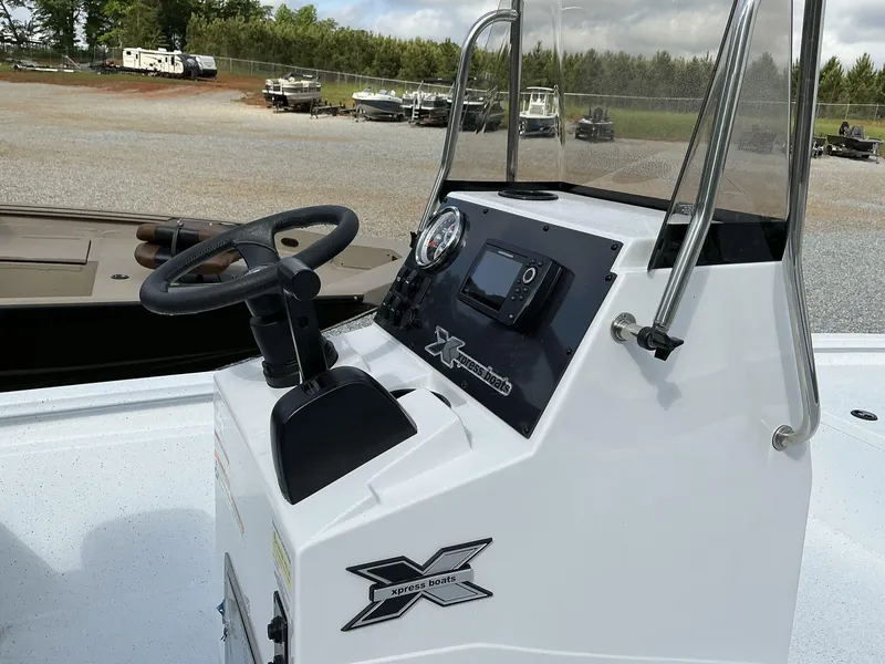 Slide: The Image of 2025 Xpress Hyper-Lift Bay Series 210 BAY-175 HP boat console with steering wheel and controls. - 7