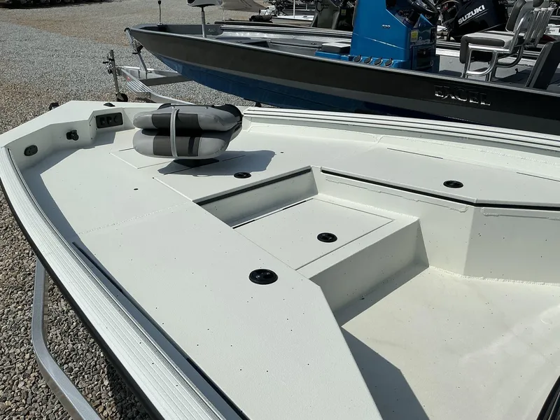 Slide: The Image of 2025 Excel Bay Pro 220 ELITE boat deck with seating and storage compartments. - 6