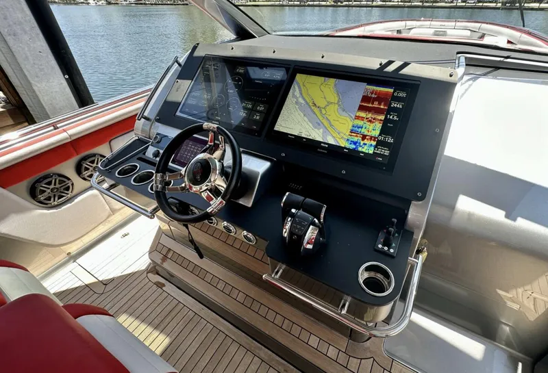 Slide: The Image of Cockpit of 2020 Cigarette 59 Tirranna with advanced navigation displays and controls. - 11