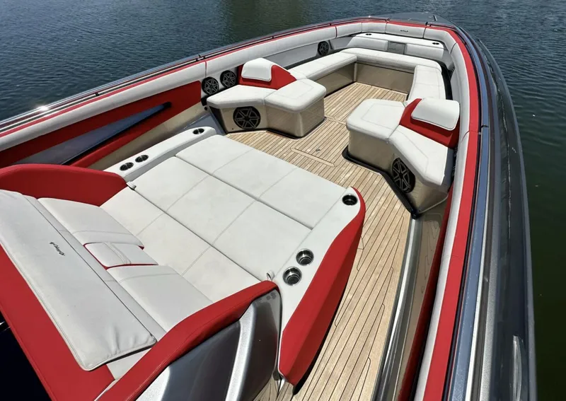 Slide: The Image of 2020 Cigarette 59 Tirranna boat interior with red and white seating, wooden deck. - 12