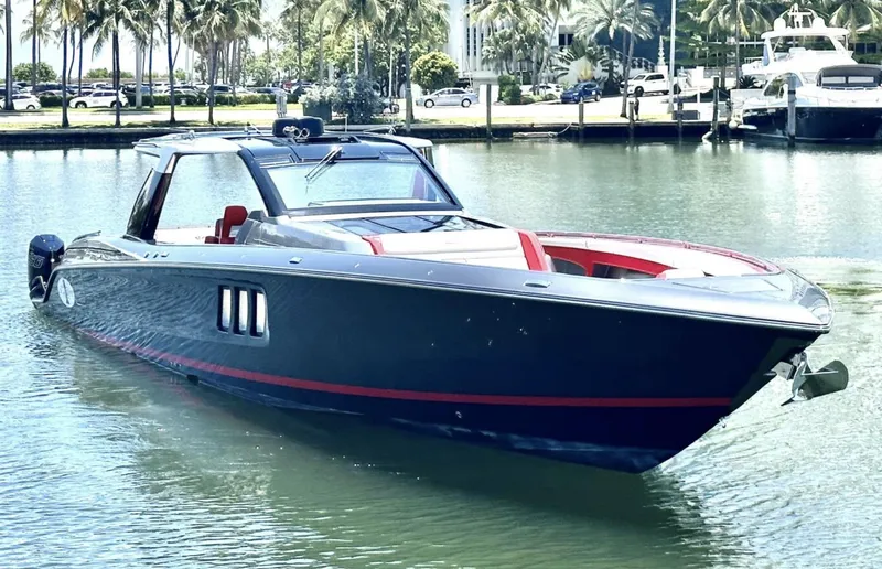 Slide: The Image of 2020 Cigarette 59 Tirranna luxury boat docked in a marina with palm trees. - 3