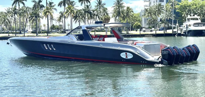 Slide: The Image of 2020 Cigarette 59 Tirranna luxury speedboat on water, surrounded by palm trees. - 4
