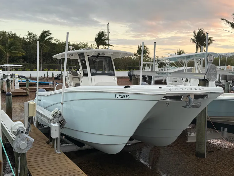 Slide: The Image of 2018 World Cat 280 CC-X boat docked at marina during sunset. - 0