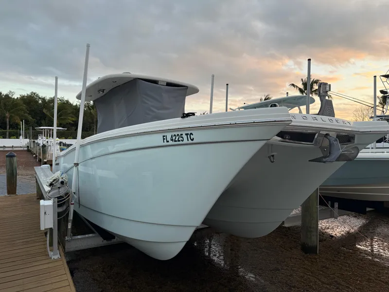 Slide: The Image of 2018 World Cat 280 CC-X boat docked at marina, side view. - 1