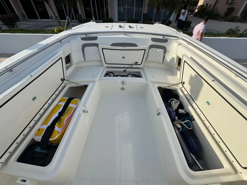 Slide: The Image of 2018 World Cat 280 CC-X boat interior with open storage compartments. - 18