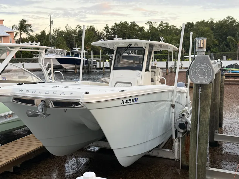 Slide: The Image of 2018 World Cat 280 CC-X boat docked at marina, front view. - 2