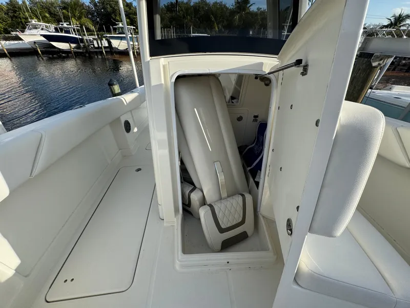 Slide: The Image of 2018 World Cat 280 CC-X boat interior with open storage compartment. - 20