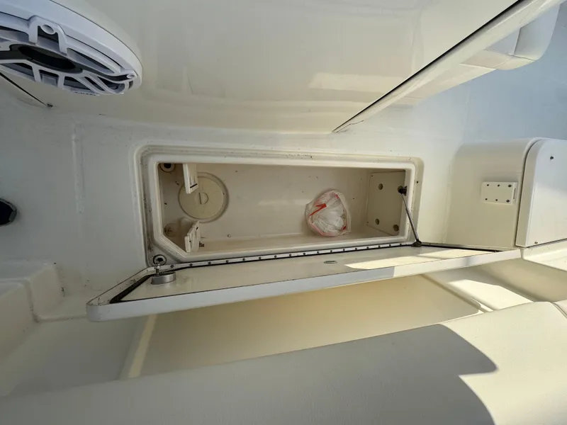 Slide: The Image of Open storage compartment on 2018 World Cat 280 CC-X boat interior. - 24