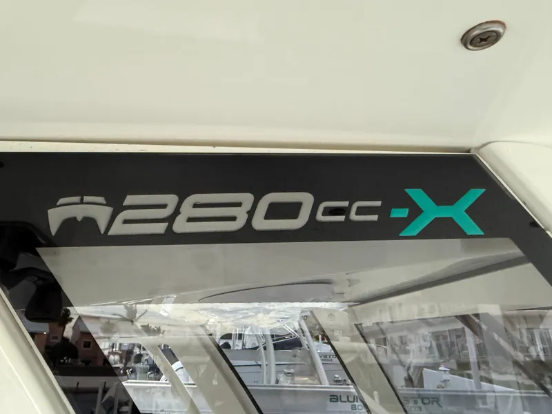 Slide: The Image of World Cat 280 CC-X 2018 boat logo on cabin window. - 25