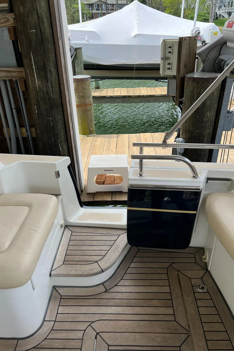 Slide: The Image of 2011 MJM 36Z yacht interior with teak flooring and dock view. - 30