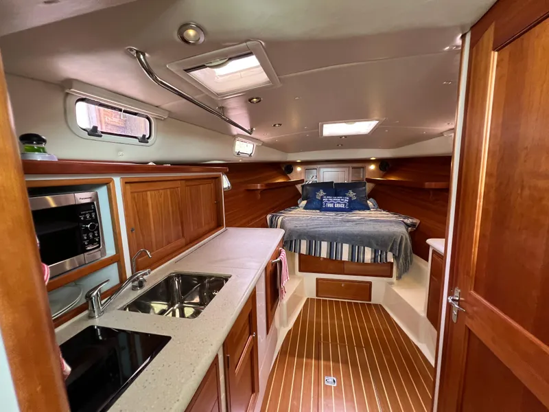 Slide: The Image of Interior of 2011 MJM 36Z yacht with kitchen and cozy sleeping area. - 36