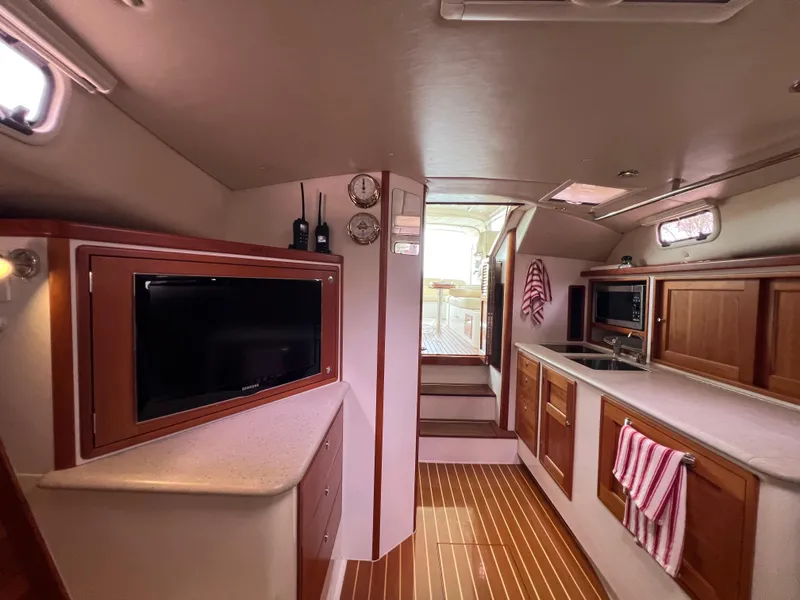 Slide: The Image of Luxurious interior of 2011 MJM 36Z yacht with modern amenities and wooden finishes. - 38