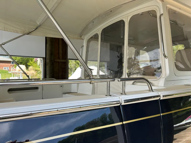 Slide: The Image of 2011 MJM 36Z yacht with sleek design and polished chrome details. - 5