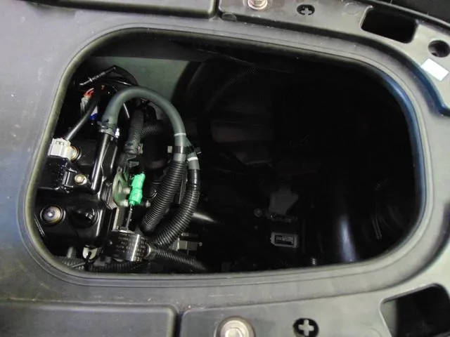 Slide: The Image of 2023 Yamaha Waverunner Jetblaster engine compartment with visible wiring and components. - 12