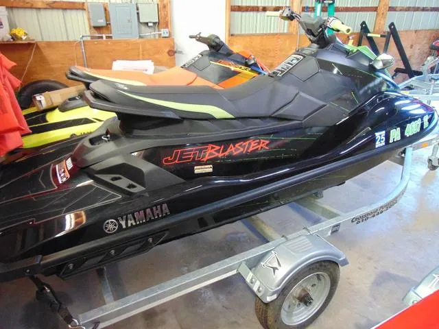 Slide: The Image of 2023 Yamaha Waverunner Jetblaster on trailer in a garage setting. - 4