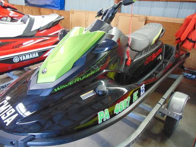 Slide: The Image of 2023 Yamaha Waverunner Jetblaster in black and green on a trailer. - 7