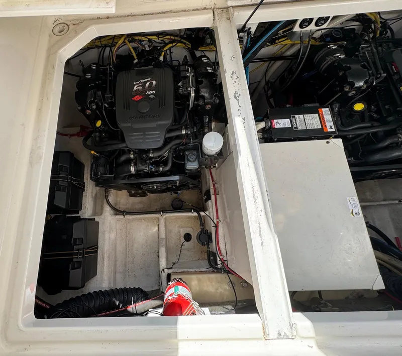 Slide: The Image of Engine compartment of a 2006 Bayliner 305 boat, showing detailed mechanical components. - 17