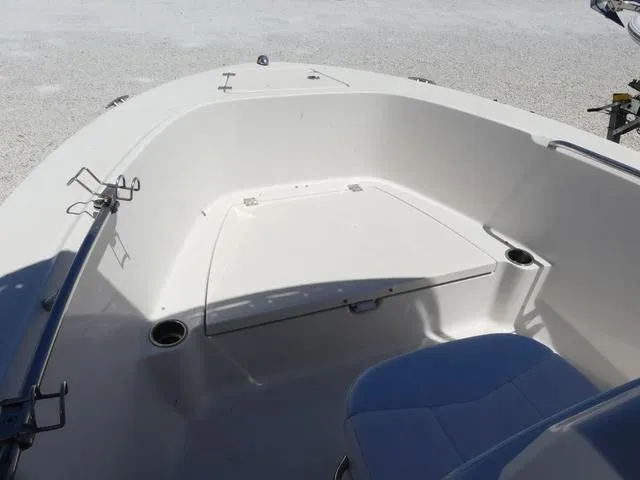 Slide: The Image of 2018 Robalo R180 boat interior with seating and storage compartments. - 10