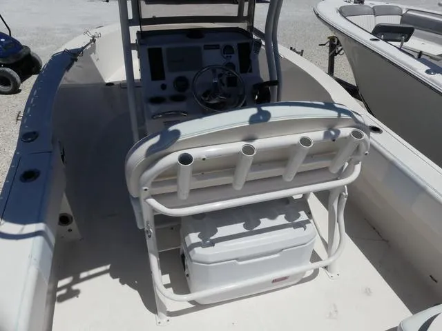 Slide: The Image of 2018 Robalo R180 boat interior with console, seating, and rod holders. - 13