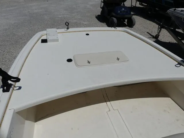 Slide: The Image of 2016 Mako Pro 17 Skiff CC boat deck, featuring storage hatch and clean design. - 12