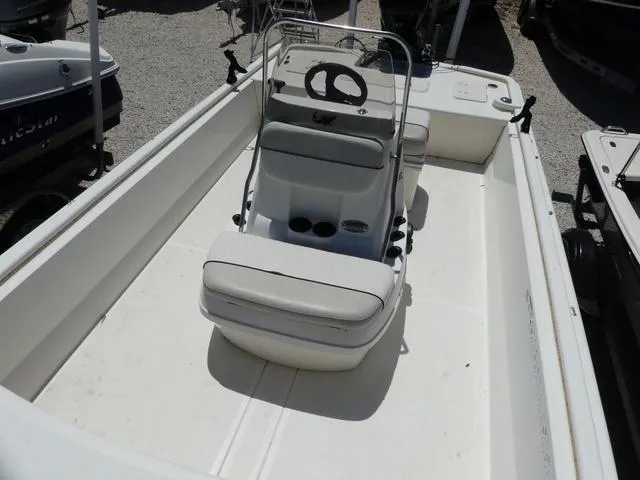 Slide: The Image of 2016 Mako Pro 17 Skiff CC boat interior with center console and seating. - 13