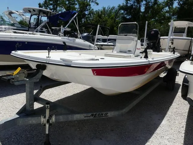 Slide: The Image of 2016 Mako Pro 17 Skiff CC boat on trailer, surrounded by other boats. - 3