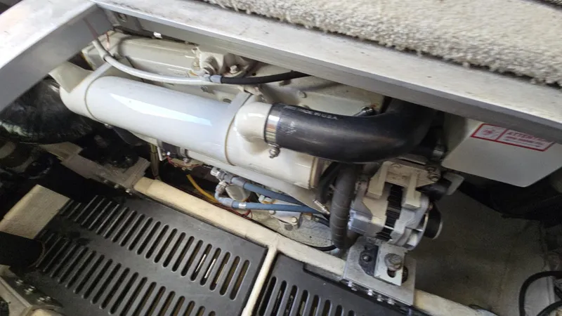 Slide: The Image of Engine compartment of a 2003 Luhrs 40 Convertible boat, showcasing mechanical components. - 17