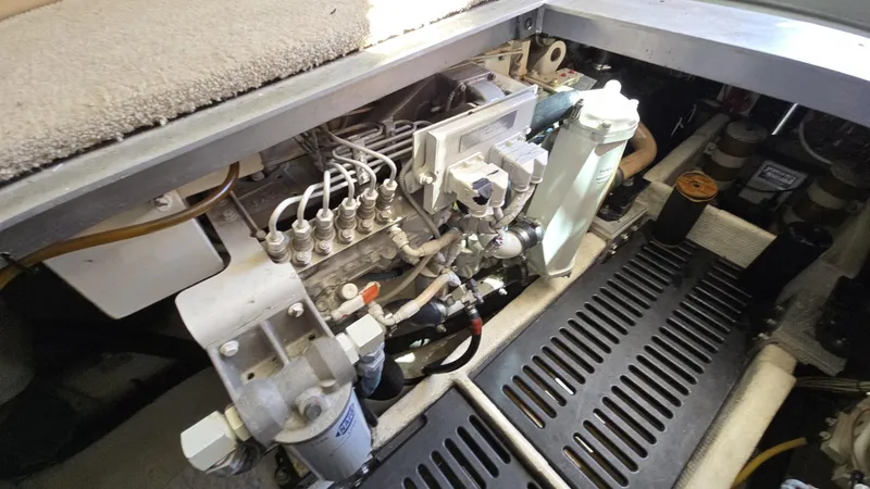 Slide: The Image of Engine compartment of a 2003 Luhrs 40 Convertible boat, showcasing mechanical components. - 20