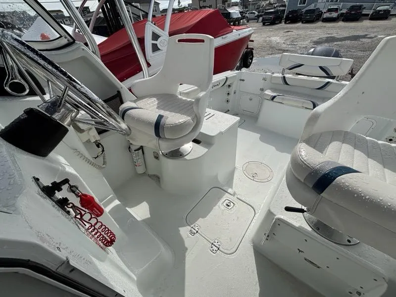 Slide: The Image of 2005 Polar 2300 boat interior with steering wheel, seats, and control panel. - 14