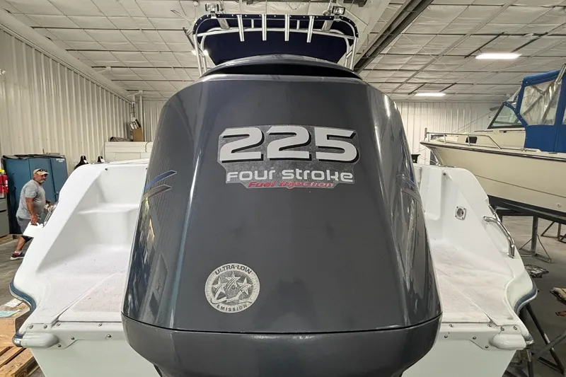 Slide: The Image of 2005 Polar 2300 boat with 225 four-stroke engine in a storage facility. - 20