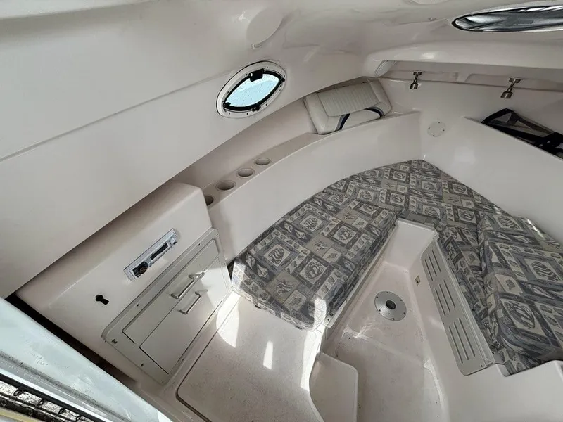 Slide: The Image of Interior of 2005 Polar 2300 boat with cushioned seating and storage compartments. - 8
