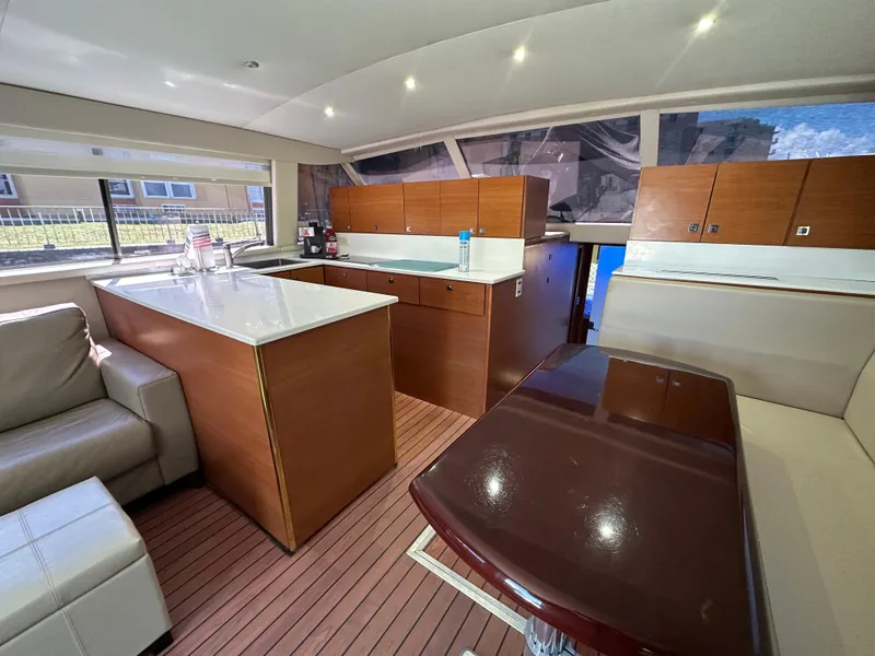 Slide: The Image of Interior of 1985 Bertram 46 Convertible yacht with modern kitchen and seating area. - 19