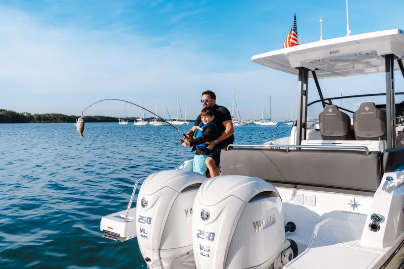 Slide: The Image of Father and child fishing on a 2025 Jeanneau Leader 9.0 WA S2 boat. - 10