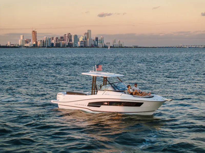 Slide: The Image of 2025 Jeanneau Leader 9.0 WA S2 boat on open sea, featuring sleek design and modern amenities. - 2