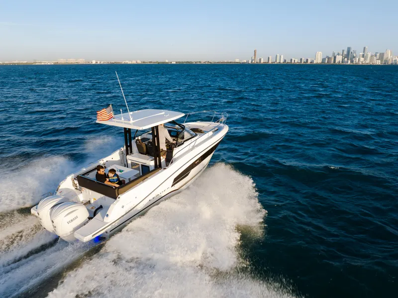 Slide: The Image of 2025 Jeanneau Leader 9.0 WA S2 cabin interior with cozy bedding and ambient lighting. - 4