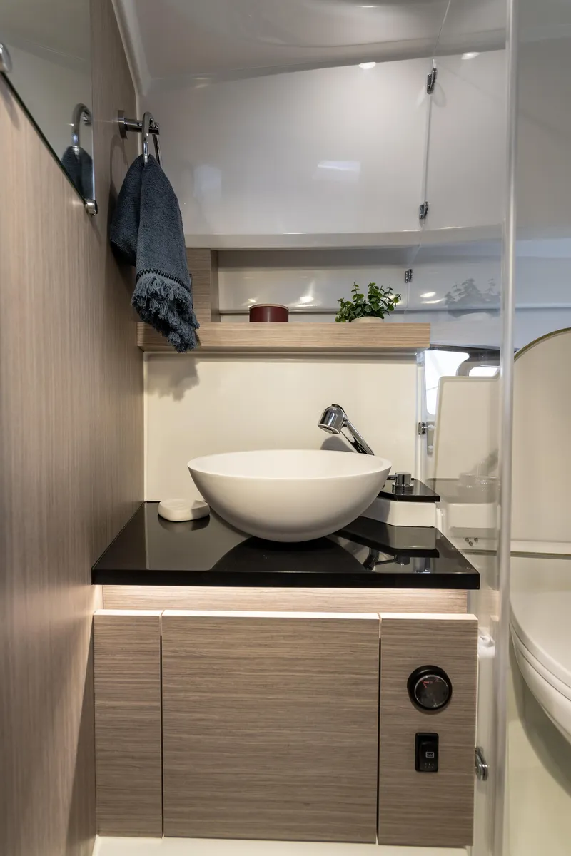Slide: The Image of 2025 Jeanneau Leader 9.0 WA S2 interior with modern cabinetry and sink. - 6