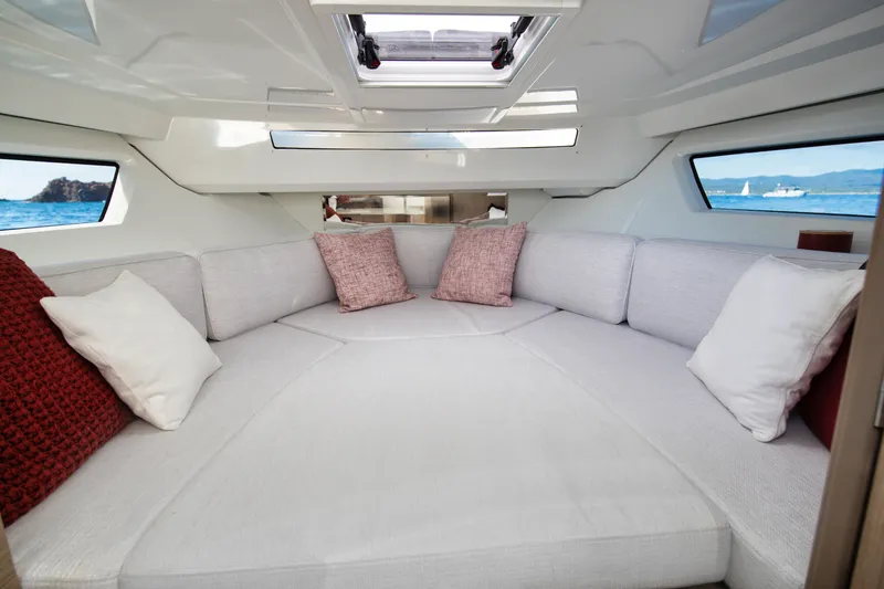 Slide: The Image of Interior of 2025 Jeanneau Leader 9.0 WA S2, featuring cozy seating and ocean views. - 7