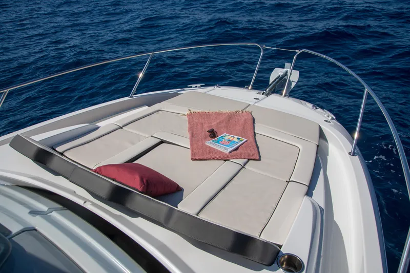 Slide: The Image of 2025 Jeanneau Leader 9.0 WA S2 boat with sunbathing deck on open sea. - 8